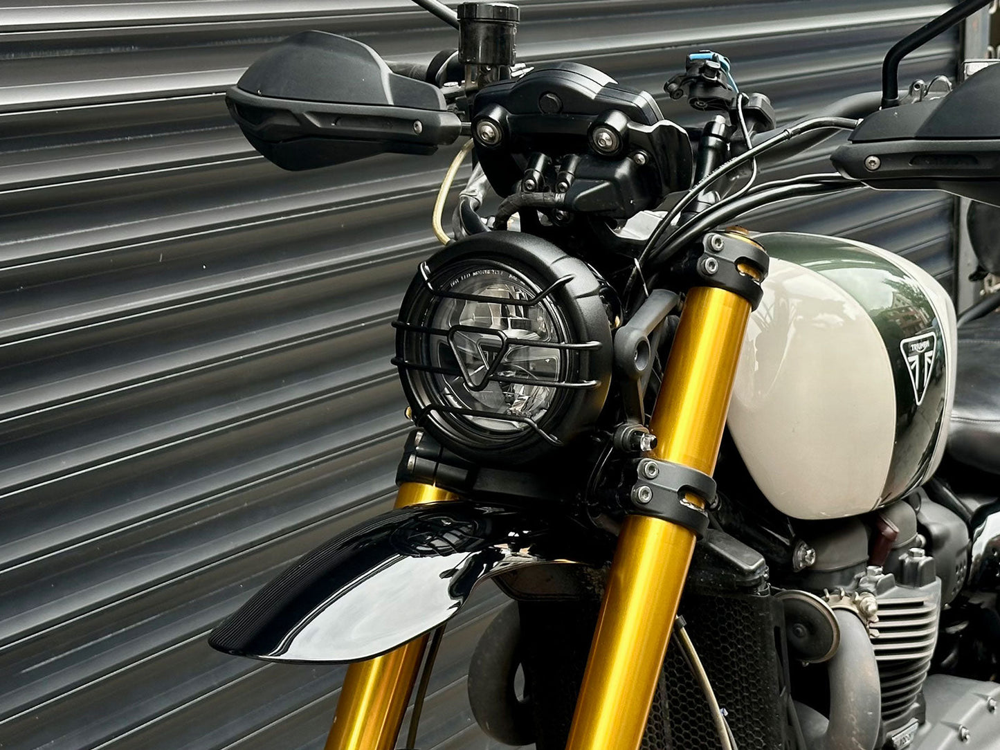 Triumph 1200 XE XC X Headlight Grill Protection Guard mounted on motorcycle
