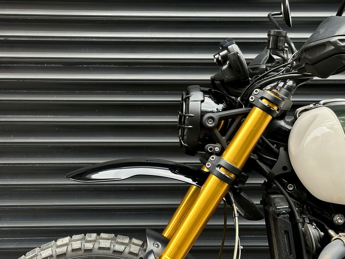 Triumph 1200 XE XC X Headlight Grill Protection Guard mounted on motorcycle side view