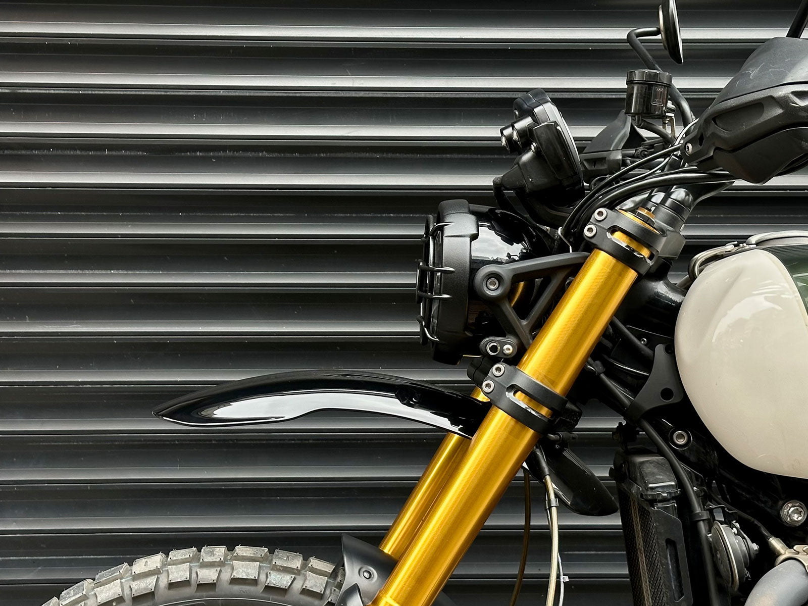 Triumph 1200 XE XC X Headlight Grill Protection Guard mounted on motorcycle side view