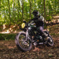 Triumph Radiator Guard Black engine guard Person riding a motorcycle in a forest setting