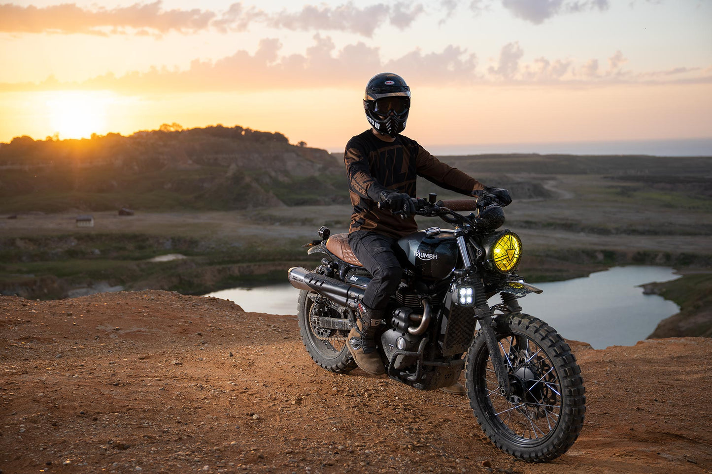 Triumph Radiator Guard Black engine guard Person on a motorcycle at sunset with a scenic background